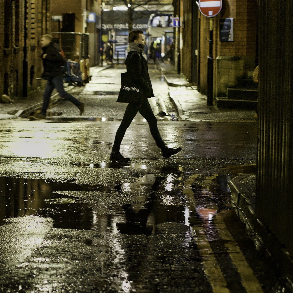 A rainy Manchester backstreet at night